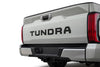 Back view of a 2022-2026 Toyota Tundra truck showing the model name on a white background
