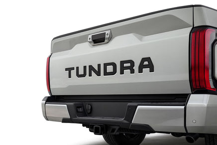 Back view of a 2022-2026 Toyota Tundra truck showing the model name on a white background