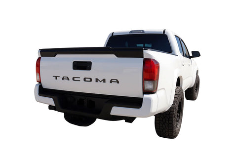 White 2024-2026 Toyota Tacoma truck shown from the rear on a white background