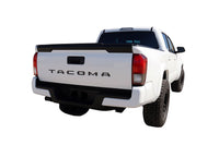 White 2024-2026 Toyota Tacoma truck shown from the rear on a white background