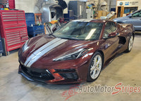 Maroon sports car Chevy Corvette C8 with white stripes in a garage setting, featuring 'AutoMotorStripes' branding.