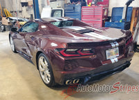 Maroon Chevy Corvette C8 sports car in a garage with AutoMotorStripes logo.