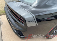 Black Dodge Charger with 'RT' badge on a driveway, 'AutoMotorStripes' logo visible