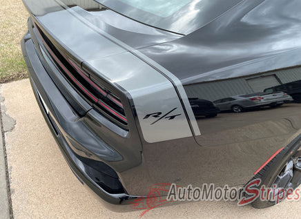 Black Dodge Charger with 'RT' badge on a driveway, 'AutoMotorStripes' logo visible
