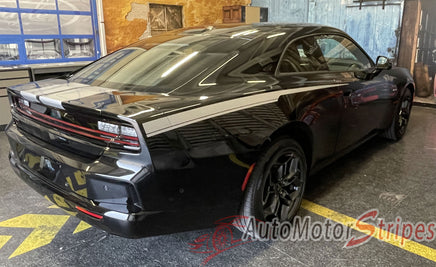 Black Dodge Charger with custom stripes in a garage setting, featuring 'AutoMotorStripes' branding. 2024-2026 Dodge Charger Recharge QP 24 Quarter Panels Factory Quality Mopar Vinyl Graphics 3M