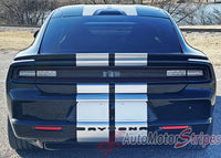Black Dodge Charger with white racing stripes on a road with 'AutoMotorStripes' branding. 2024-2026 Dodge Charger Racing Stripes N-Charge Rally 24 R/T Scat Pack Daytona Factory Quality Mopar Style Vinyl Graphic Kit 3M