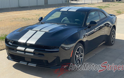Black 2026 Dodge Charger Sixpack with white stripes on a driveway, featuring 'AutoMotorStripes' branding.
