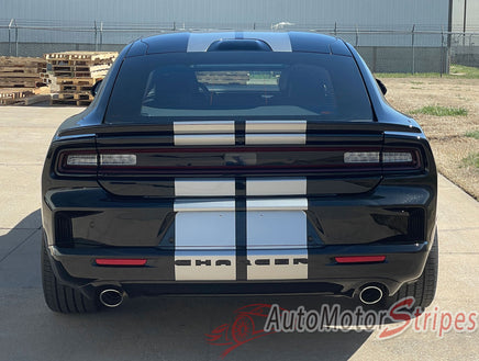 Black 2026 Dodge Charger Sixpack with white racing stripes on a concrete surface, featuring 'AutoMotorStripes' branding.