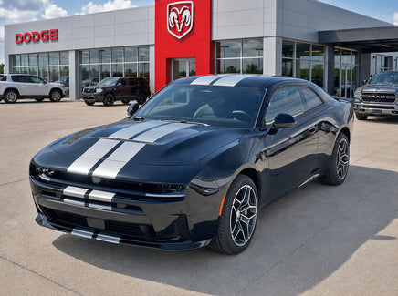 Black 2026 Dodge Charger Sixpack car with white stripes in front of a Dodge dealership