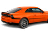 Orange 2026 Dodge Charger muscle car with 'Six Pack' vinyl graphics branding on a white background