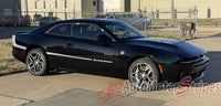 Black 2026 Dodge Charger muscle car with 'Sixpack' vinyl graphics branding on a paved surface.