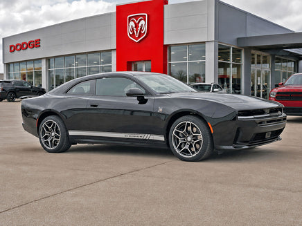 Black 2024-2026 Dodge Charger Sixpack car parked in front of a Dodge dealership