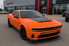 Orange 2026 Dodge Charger Sixpack car in front of a Dodge dealership