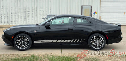 Black 2024-2026 Dodge Charger Sixpack muscle car with 'Sixpack' stripe on a white building background