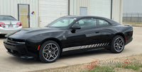 Black 2024-2026 Dodge Charger Sixpack with racing stripes parked in front of a building