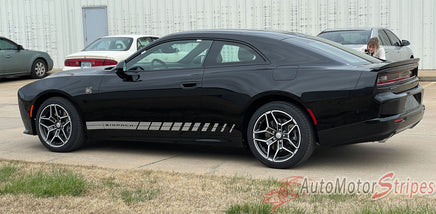 Black 2024-2026 Dodge Charger Sixpack with white racing stripes parked on a concrete surface.